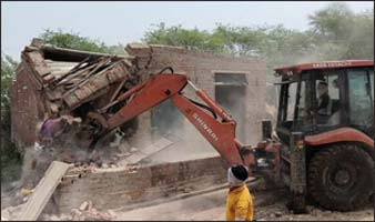 Administration's bulldozer runs on the house of the accused of cow slaughter